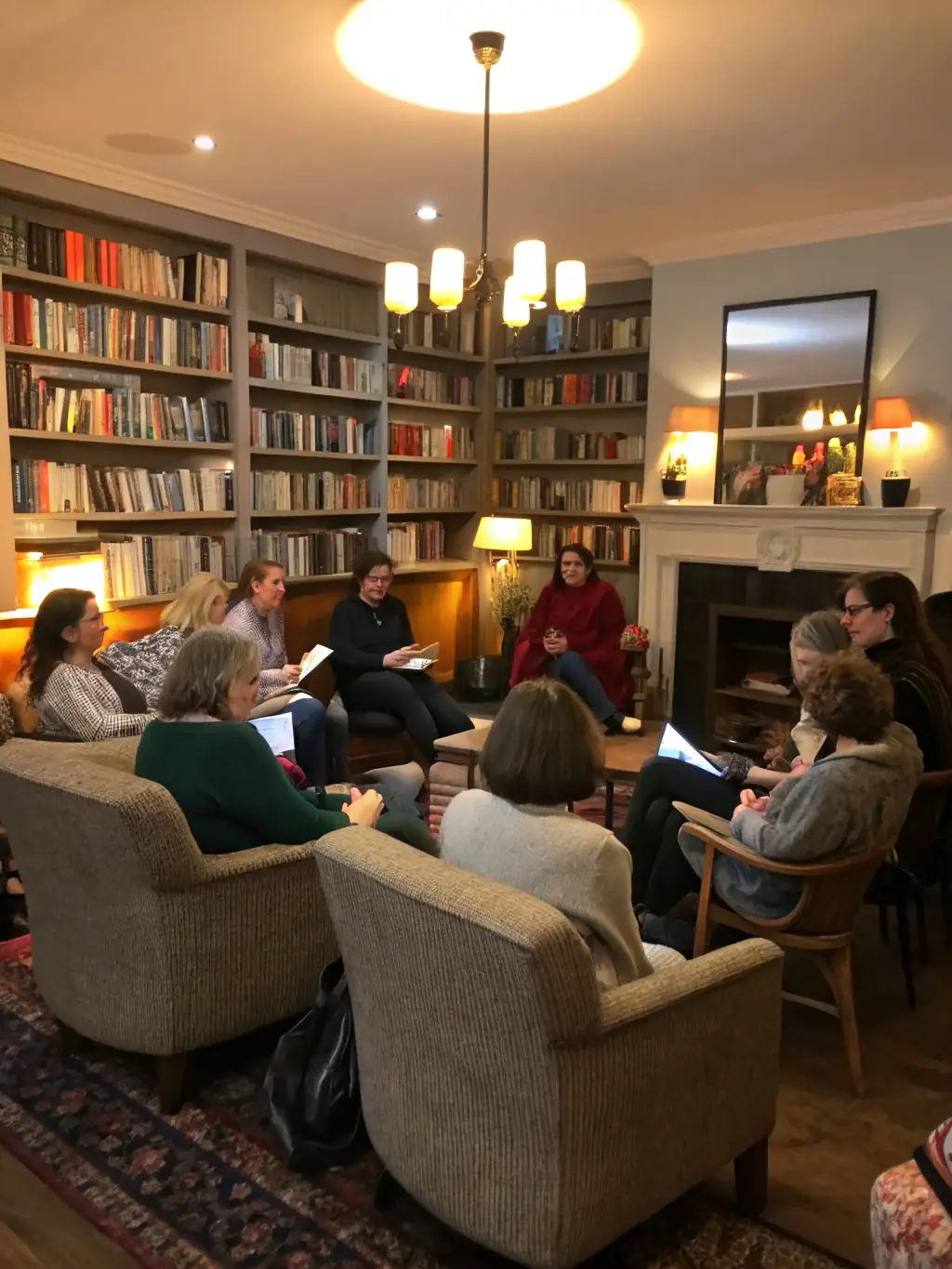 A group of people sitting around a table in a library, engaged in a lively discussion about a book, with open books and coffee cups on the table, warm lighting, and a focus on the expressions of the participants.